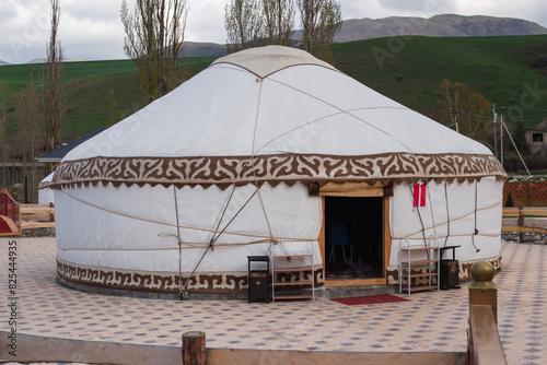 Restaurant from a yurt complex of nomadic houses in the village of Kashka-Suu near Bishkek, during sunset. Spring in Kyrgyzstan.