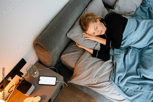 A woman sleeps at home photo