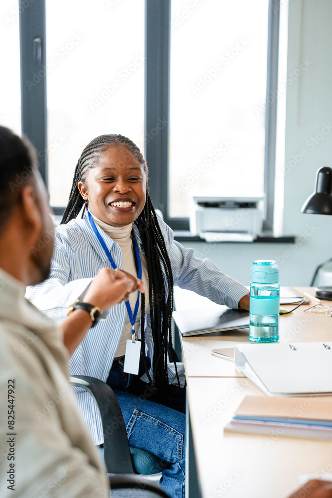 A man and a woman are talking in the office A man and a woman are talking in the office