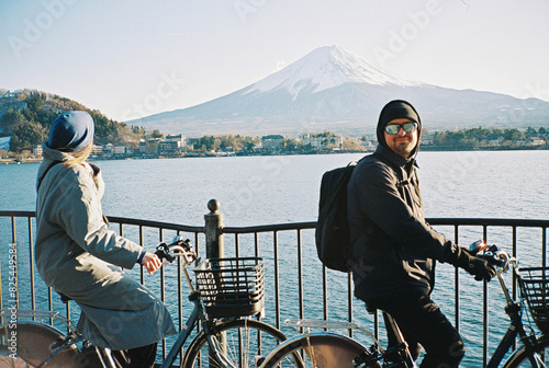 Young friends on bicycles opposite Fuji photo