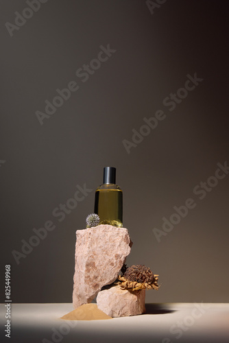 Perfume bottle arranged with dried flowers photo