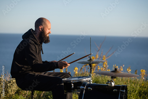 Musician practicing drums in nature