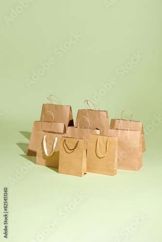 Recycled Shopping Brown paper bag on green background .