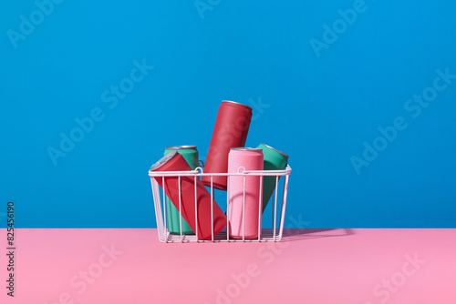 a whole shopping basket with soft drink cans photo