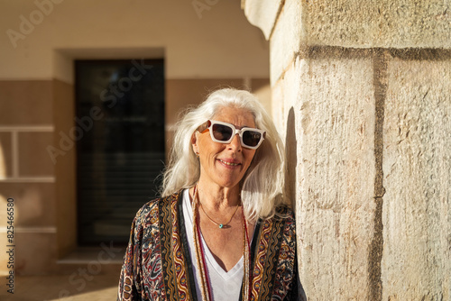 white-haired mature woman in a nice European square photo