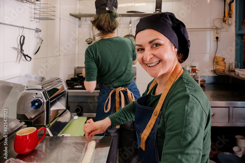 Joyful chef prepares traditional Georgian cuisine. photo