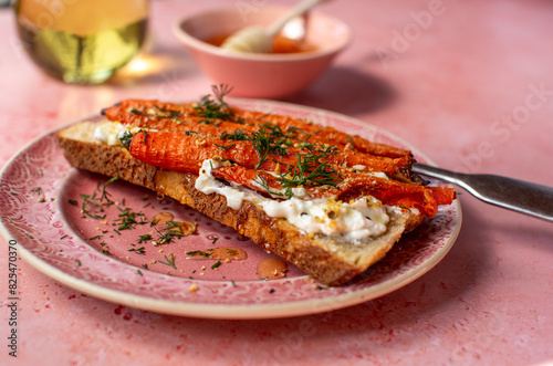 Toasted sourdough bread with roasted carrots and feta photo