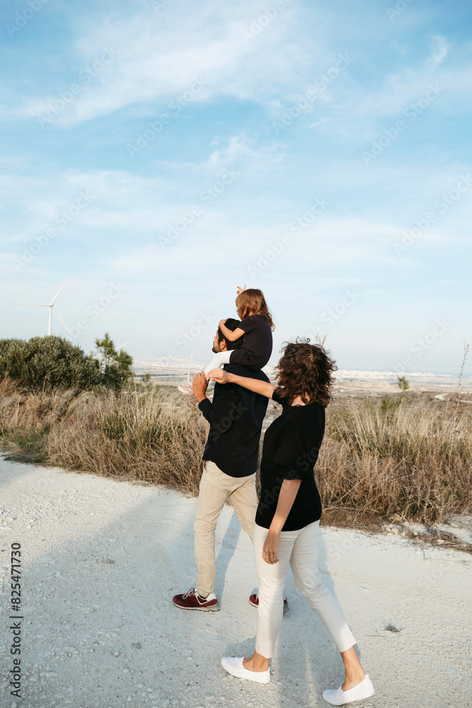 © Irina Polonina/Stocksy - A family with a small child walks during a trip © Irina Polonina/Stocksy - A family with a small child walks during a trip