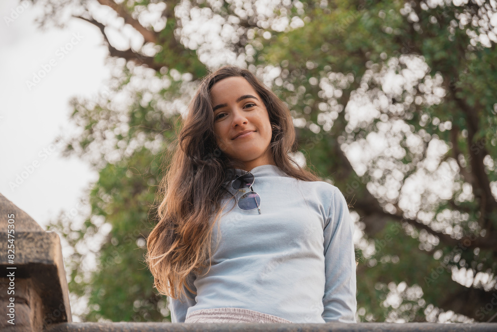 Portrait of a beautiful young woman dressed casually, smiling and looking happy, confident. Portrait of a beautiful young woman dressed casually, smiling and looking happy, confident.