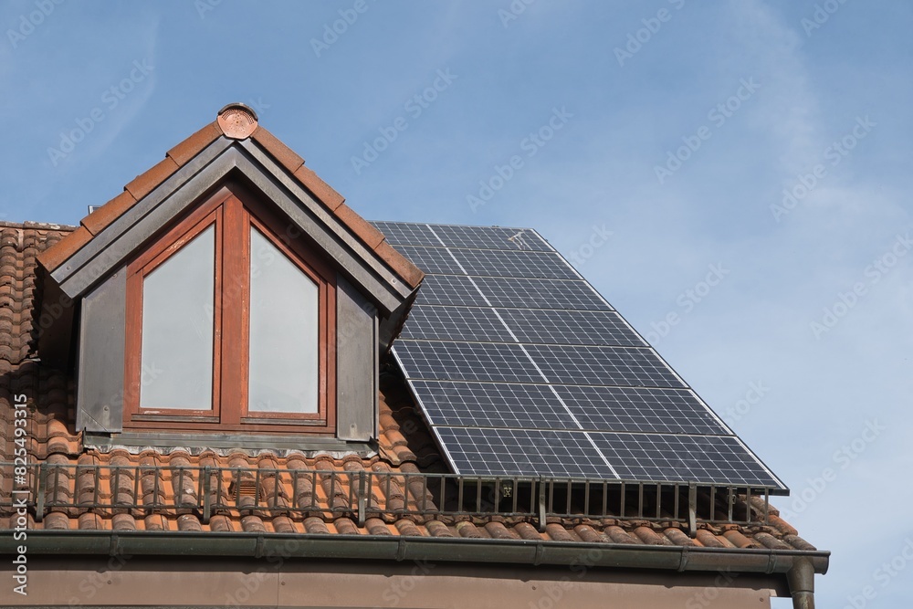 Solar modules on a residential building roof Solar modules on a residential building roof