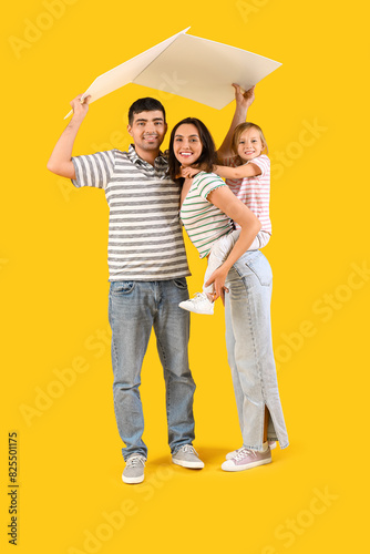 Happy family with cardboard...