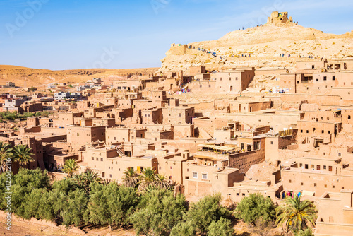 View of Ksar Ait Ben Haddou  old Berber adobe-brick village or kasbah in green oasis with palm trees  Ouarzazate  Morocco  North Africa