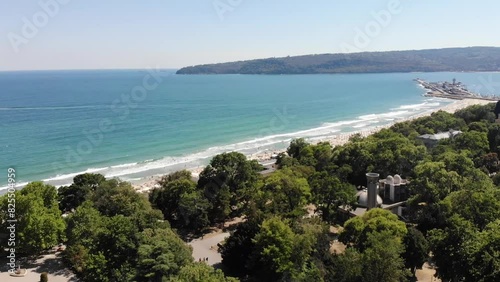 Panoramic aerial drone top view of beach, seashore, umbrellas, coastline and hotels in Varna, Bulgaria, near Golden Sands. Popular summer resort near Varna on Black sea. Summer holiday destination in 