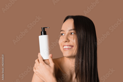 Young woman with cosmetics ...