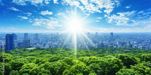 Aerial view of a cityscape with sun rays and green forest under a blue sky with scattered clouds
