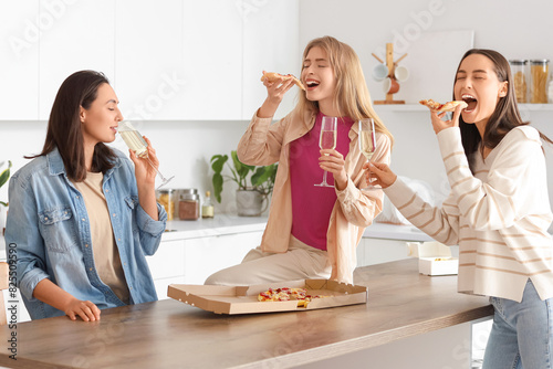 Young women with champagne ...