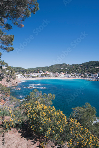 Beautiful turquoise beach in quiet Mediterranean waters in a town in Costa Brava, Catalonia