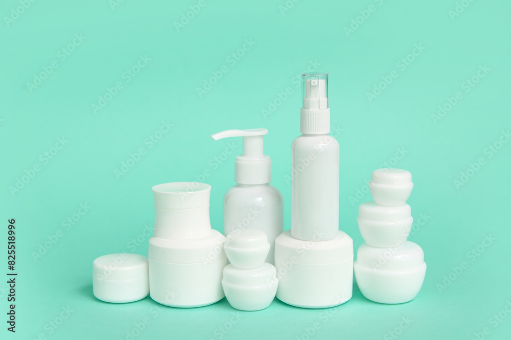 Different cosmetic products on green background Different cosmetic products on green background