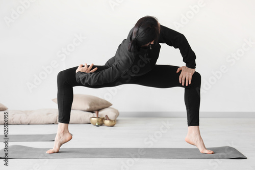Sporty young woman practici...