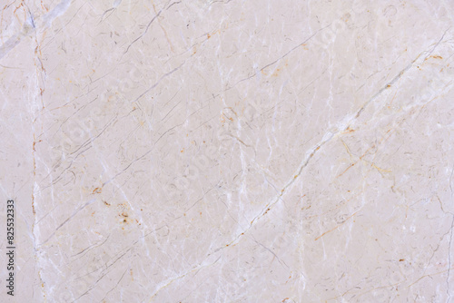 Close-up of a marble surface showing natural cracks and patterns, highlighting the texture and imperfections of the stone. Stone wall flooring ceramic tile, faience patterns, texture, background