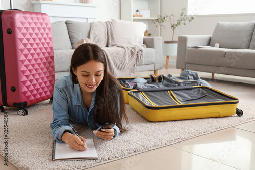 Young woman making travel c...