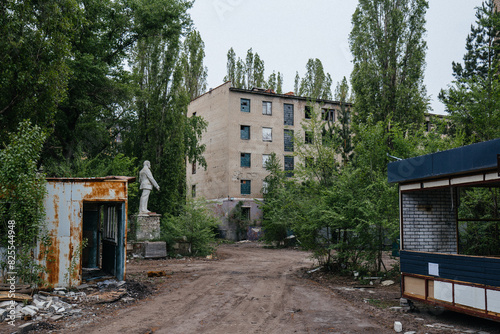 Abandoned white brick multistory houses, decaying cityscape of ghost town