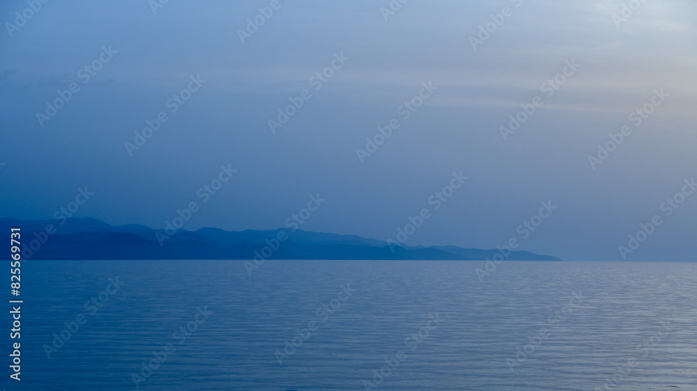 sea ​​view and burning in cyprus after sunset blue hour