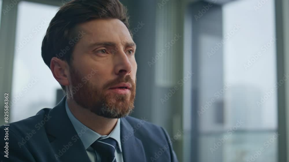 Closeup thoughtful boss drinking coffee at cityscape office. Man chatting laptop Closeup thoughtful boss drinking coffee at cityscape office. Man chatting laptop