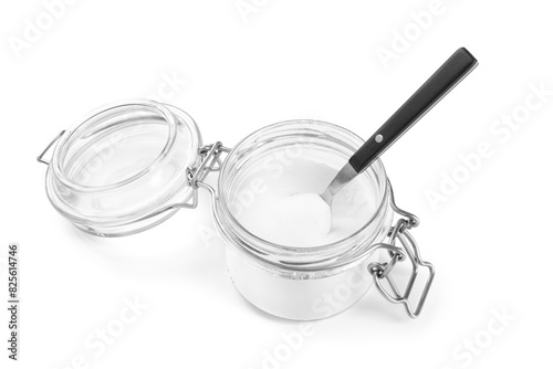 Baking soda and spoon in glass jar isolated on white