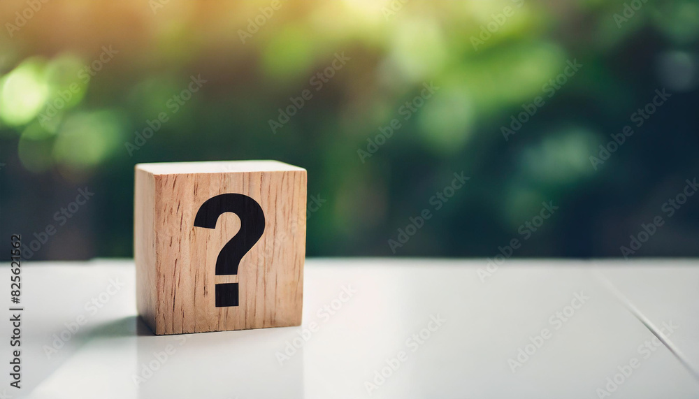 wooden block with a question mark stands on a white table, symbolizing uncertainty or inquiry. The minimalist backdrop emphasizes the concept, providing ample caption space on the right wooden block with a question mark stands on a white table, symbolizing uncertainty or inquiry. The minimalist backdrop emphasizes the concept, providing ample caption space on the right