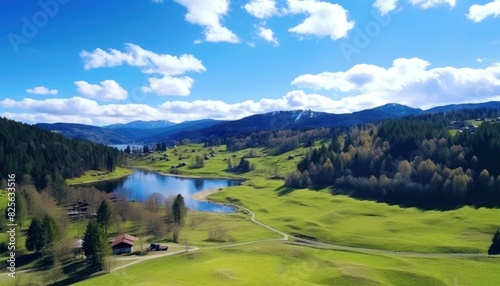 Views of fertile land surrounded by stunning green vegetation, rolling hills and mountains with clear skies in spring.