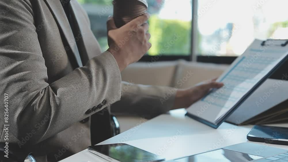Close up Business woman using calculator and laptop for do math finance on wooden desk, tax, accounting, statistics and analytical research concept