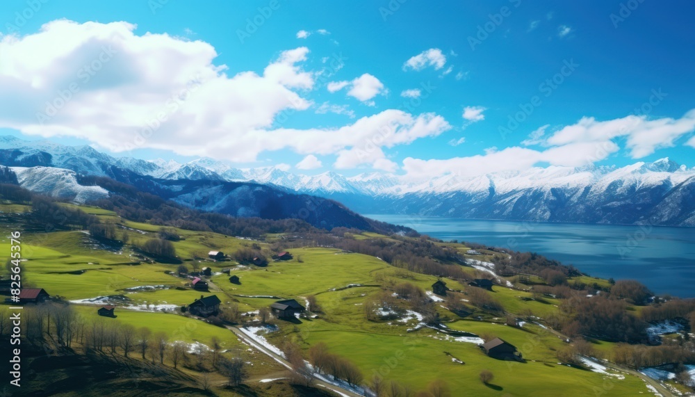 Stunning spring views of the countryside and green grass and beautiful flowers, with rolling hills and fertile soil, against a backdrop of vast mountains