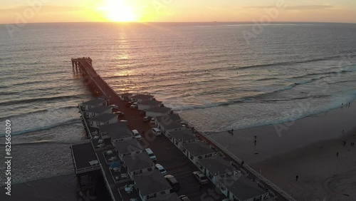 Sunset over crystal pier in San Diego, CA photo