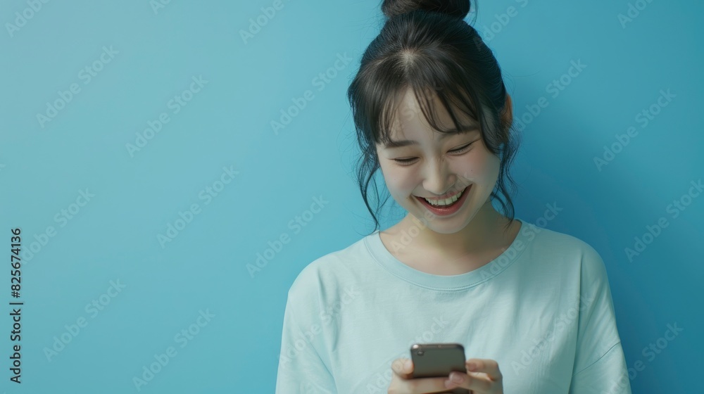 A Banner Of A Happy Asian Woman Feeling Happiness And Standing While Typing On A Smartphone On A Blue Background, Symbolizing Joy In Modern Life, Hd Images A Banner Of A Happy Asian Woman Feeling Happiness And Standing While Typing On A Smartphone On A Blue Background, Symbolizing Joy In Modern Life, Hd Images