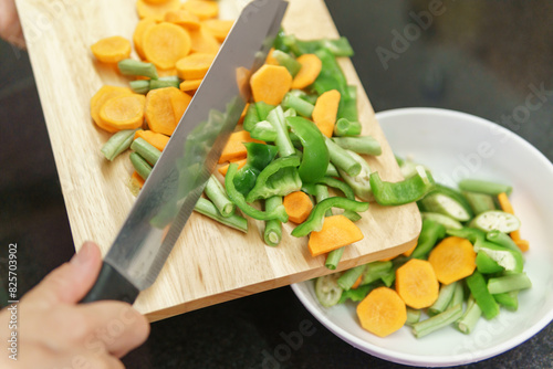 Colorful view of pieces of vegetables on a cutting board