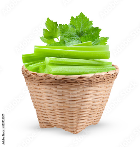 Celery in basket isolated on white background © supamas
