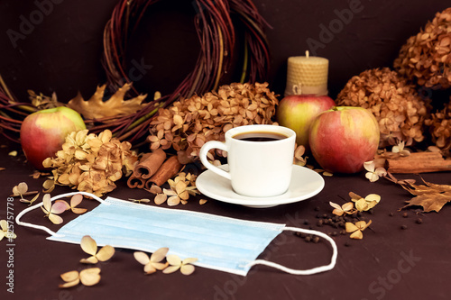 Wallpaper Mural Cup of coffee, removed medical mask, blue surgical protective mask in autumn composition Torontodigital.ca