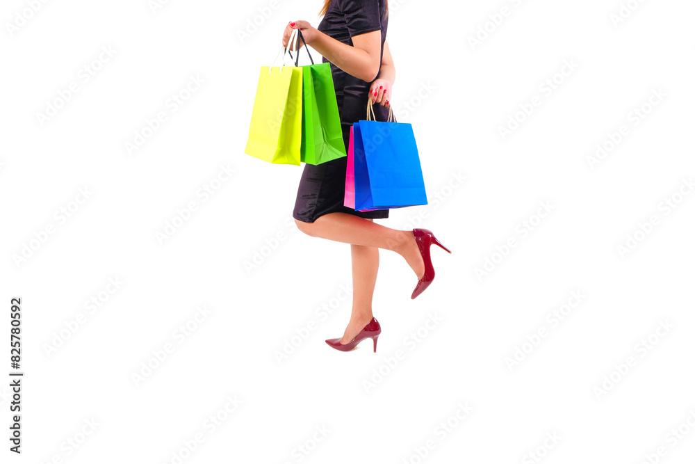 The woman happily and holds colorful shopping bags. She held up the shopping bag. Show happiness in purchasing products	
