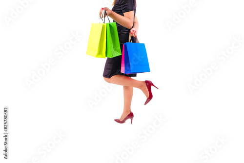 The woman happily and holds colorful shopping bags. She held up the shopping bag. Show happiness in purchasing products 