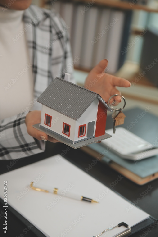 buy or sell real estate mortgage, Sale representative offer house purchase contract to buy a house or apartment and mortgage Money and Financial Concepts buy or sell real estate mortgage, Sale representative offer house purchase contract to buy a house or apartment and mortgage Money and Financial Concepts