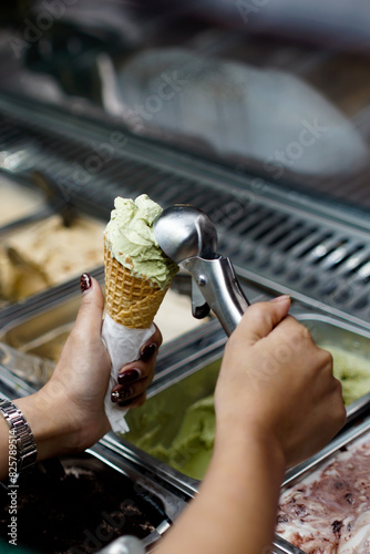 scooping ice cream into a cone