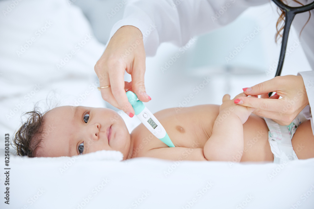 Doctor, hands and baby with thermometer for checkup, exam or test in healthcare on bed at home. Woman or pediatrician checking infant or young newborn for medical care or fever in bedroom at house Doctor, hands and baby with thermometer for checkup, exam or test in healthcare on bed at home. Woman or pediatrician checking infant or young newborn for medical care or fever in bedroom at house