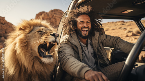 Photographer and lion in savanna.