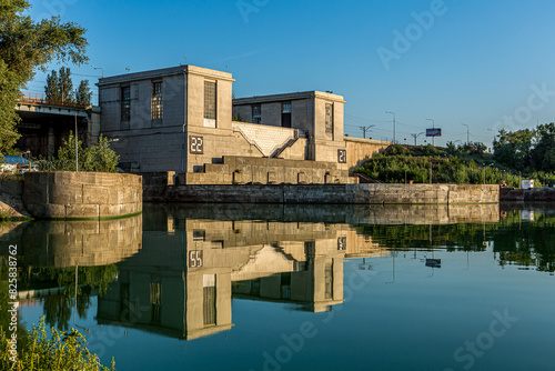 Volga river. Gateway of the Zhigulevskaya HPP dam. Samara Region. Russia. Quiet calm blue water early in the morning against a clear sky with a beautiful reflection. photo