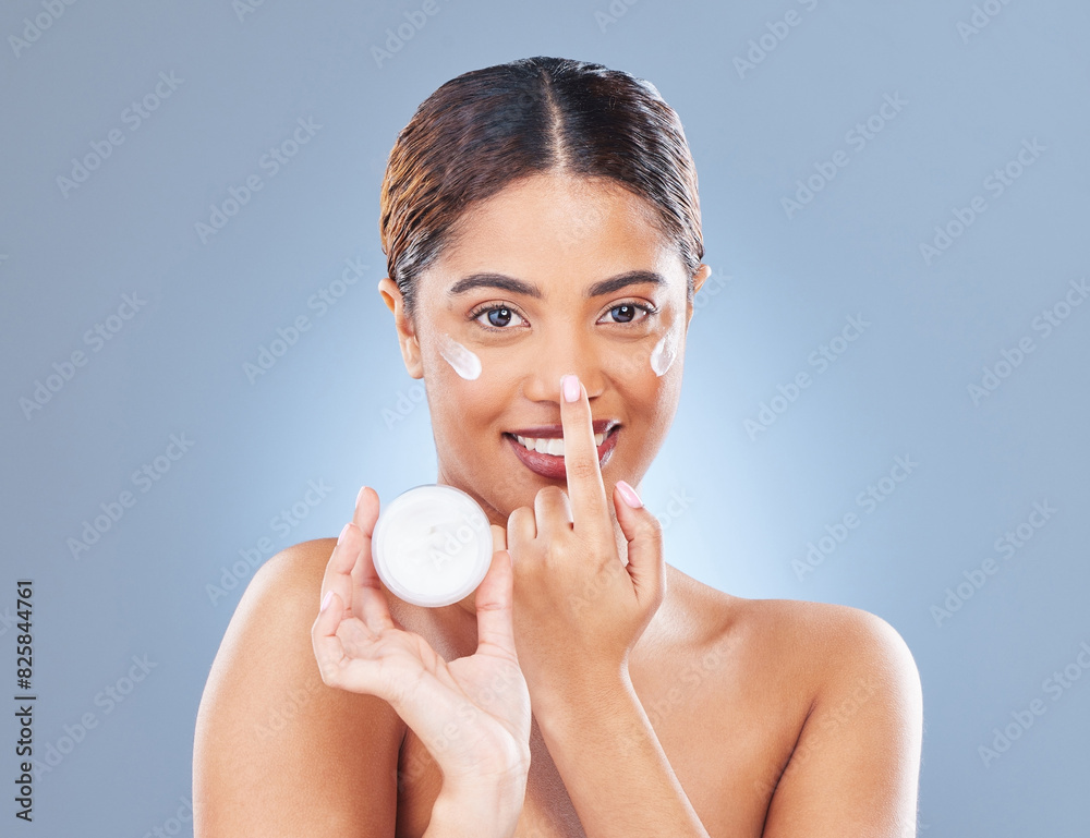 Portrait, cream or woman with skincare, wellness or dermatology on blue studio background. Face, person or model with clear skin, creme or lotion for beauty, grooming routine or aesthetic with smile Portrait, cream or woman with skincare, wellness or dermatology on blue studio background. Face, person or model with clear skin, creme or lotion for beauty, grooming routine or aesthetic with smile