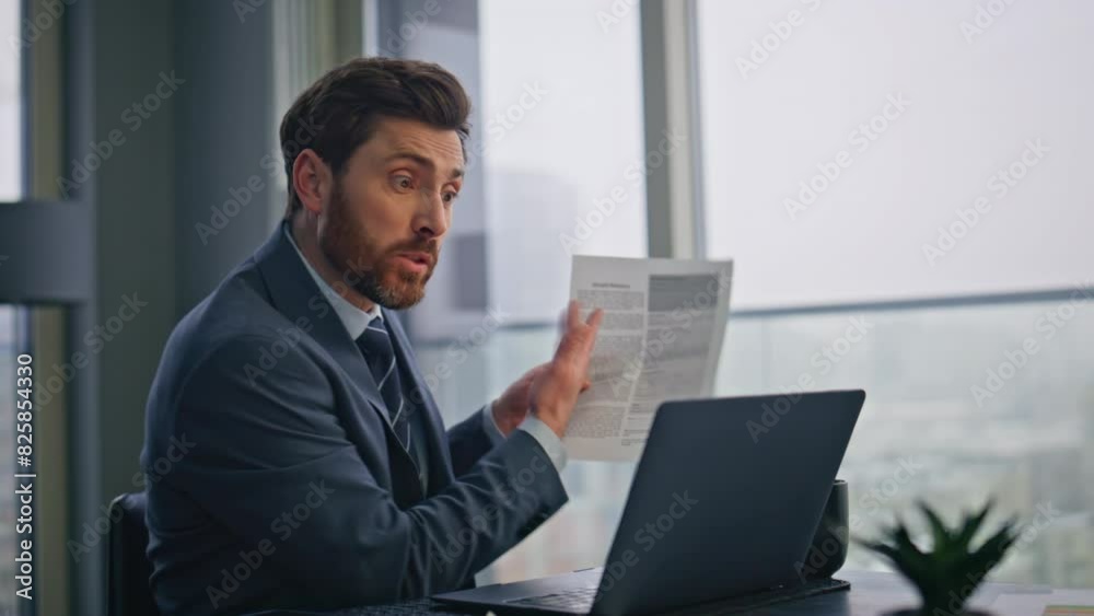Angry boss speaking web conference in office closeup. Manager pointing papers Angry boss speaking web conference in office closeup. Manager pointing papers