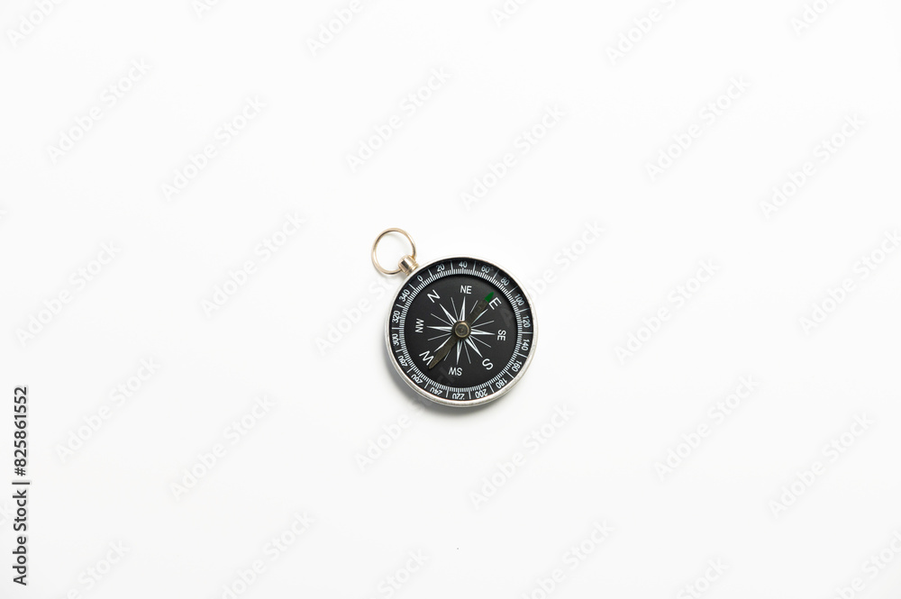 Modern old style compass lies on a white background top view