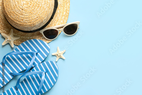 Top view of flip flops,sunglasses,starfish and straw hat with copy space for text. Summer holiday concept