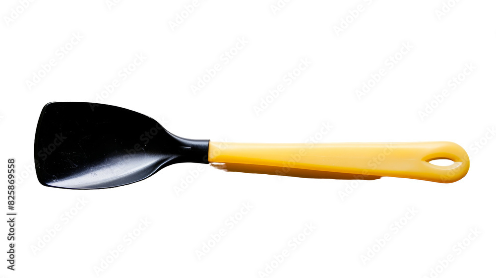 A black and yellow spatula resting on a clean white background, ready for kitchen use A black and yellow spatula resting on a clean white background, ready for kitchen use